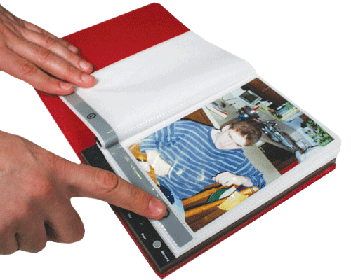 a phto of a man pointing to a photo in the talking photo album
