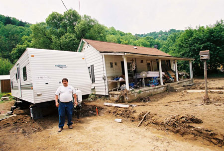 a photo of a home damaged by flood waters