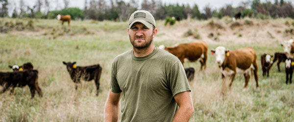 a photo of Garret Dwyer with is cattle