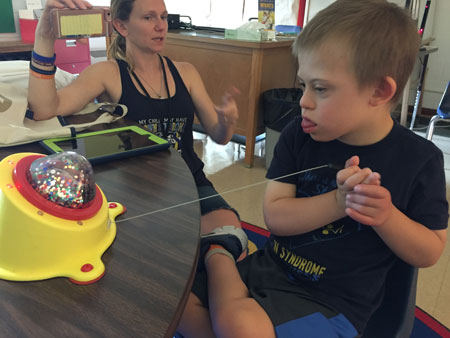 a photo of a boy playing with the Pinser Switch