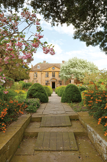 a photograph of an accessible garden with ramps for each stair up to the walkway