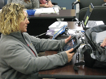 a photo of a student studying a tablet